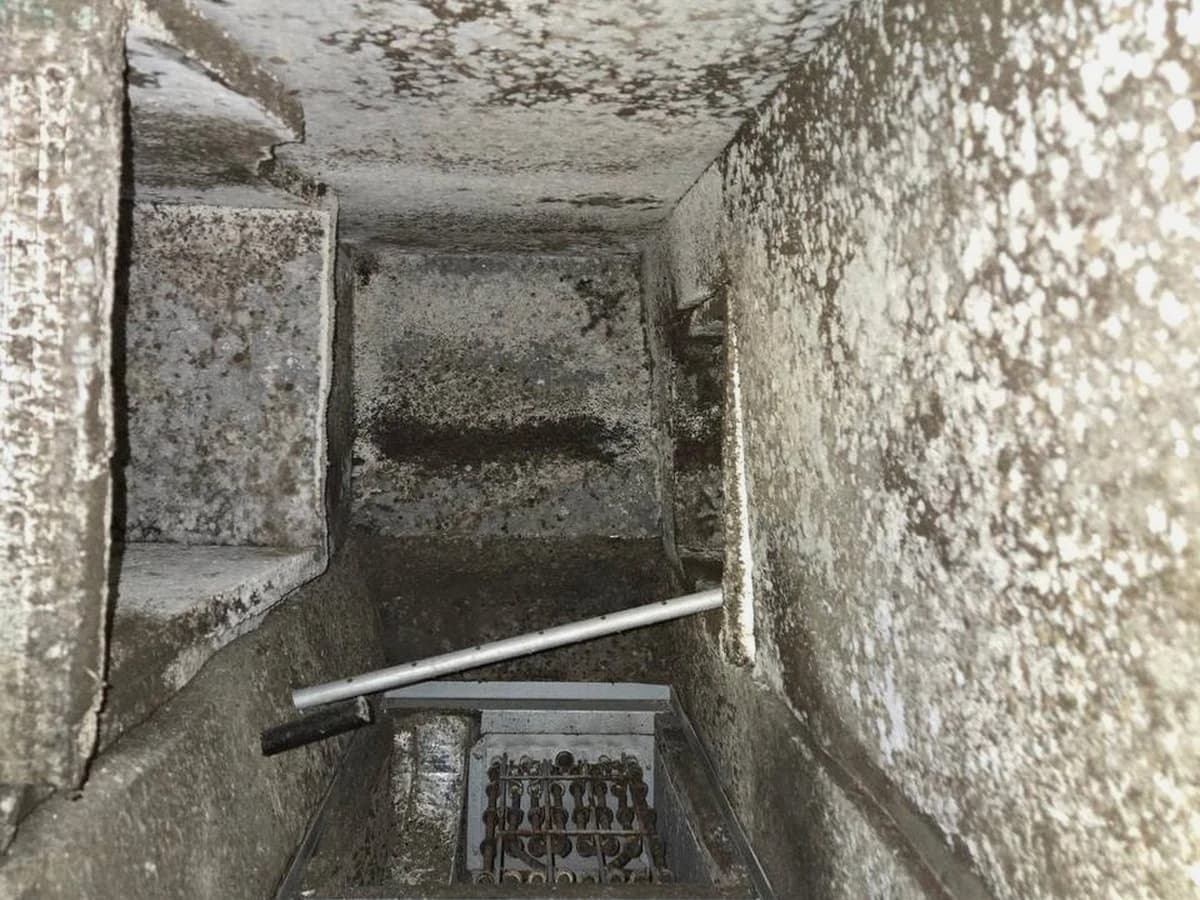 Fiberglass duct interior before restoration