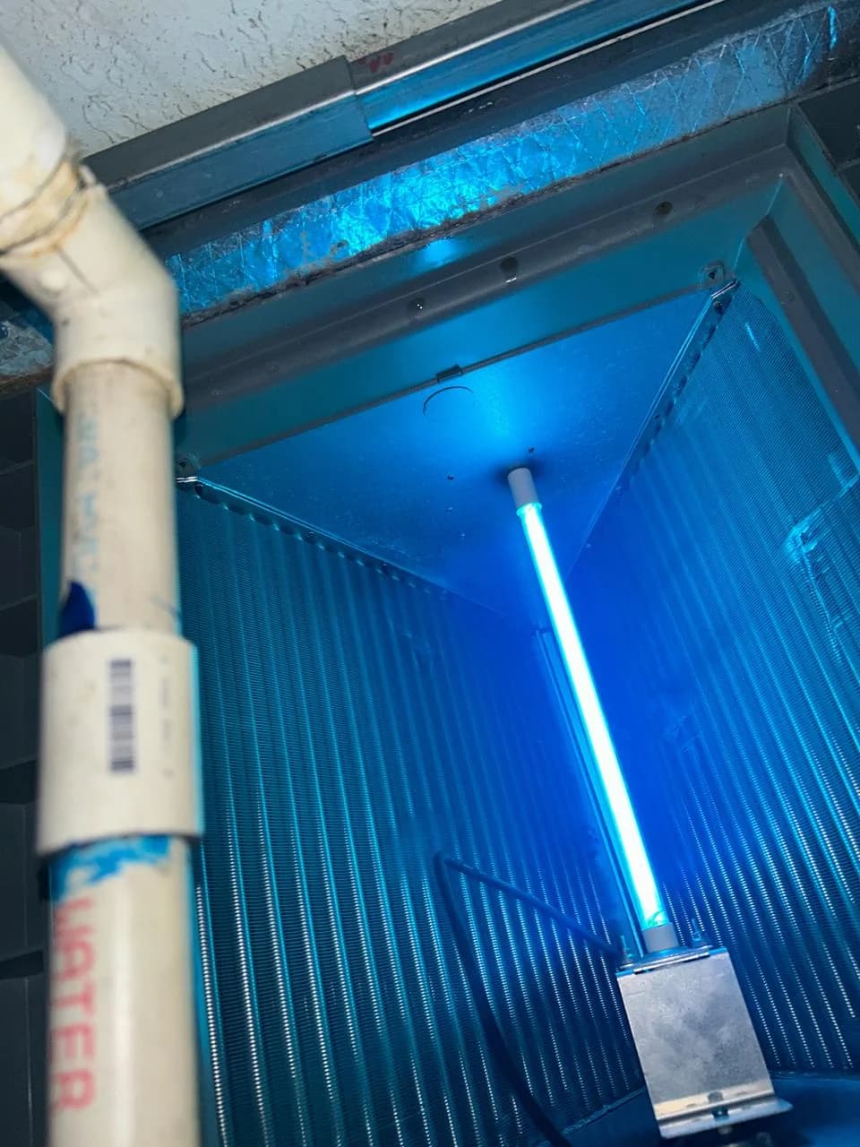 UV light installed beside an HVAC evaporator coil