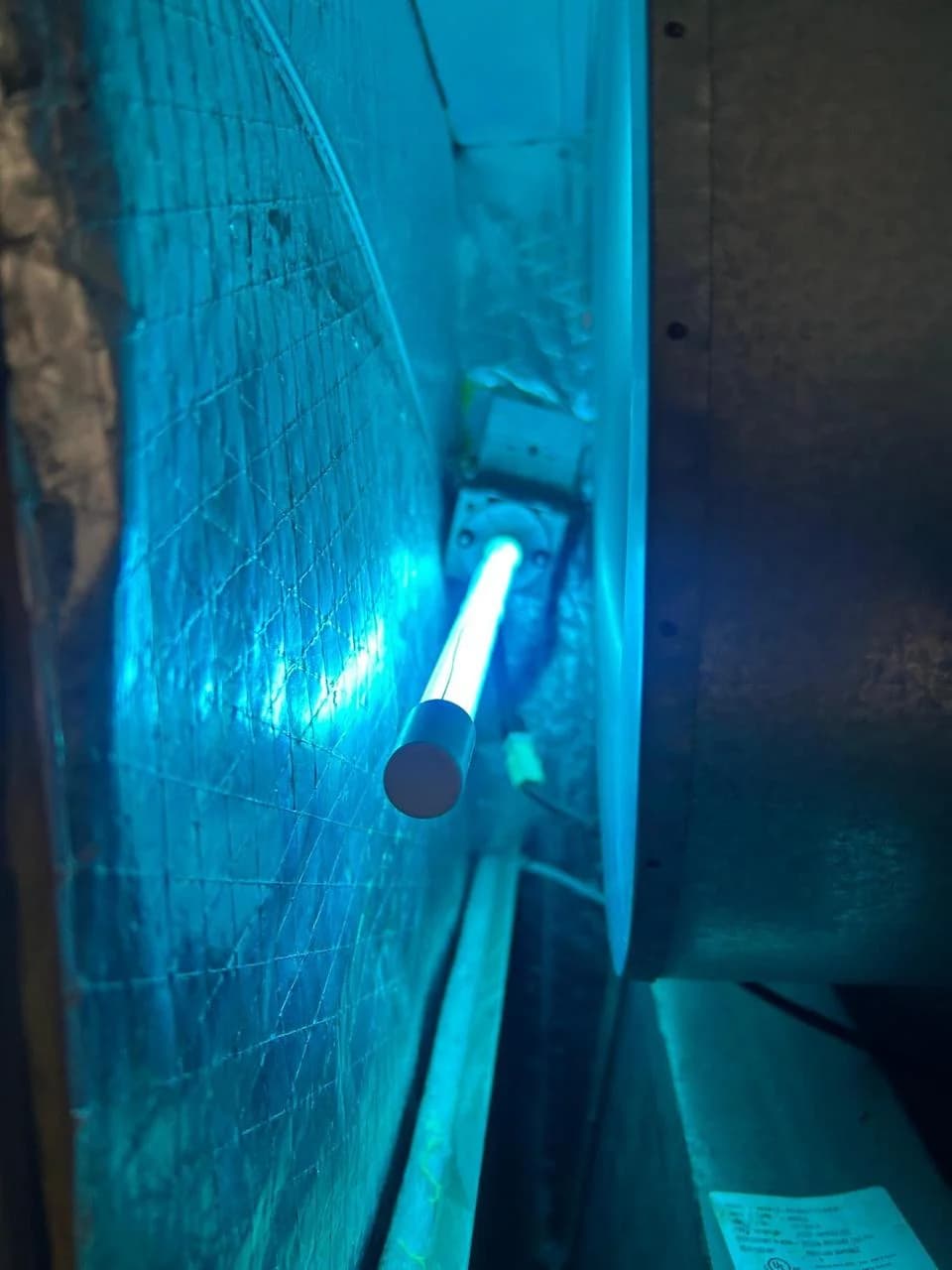Operating UV light illuminating the HVAC coil compartment